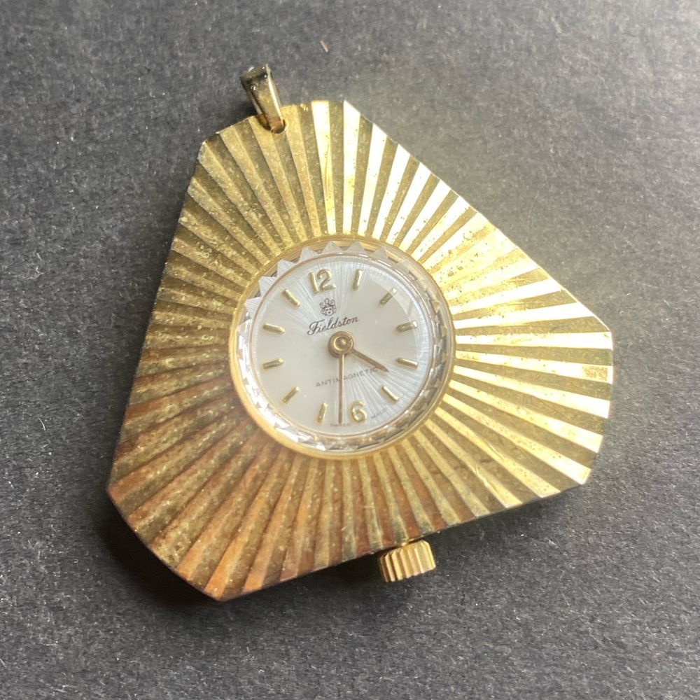 Vintage gold toned mid century pendant watch stamped Fieldstone and antimagnetic